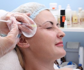 Middle-aged female facial botox injection Stock Photo 05