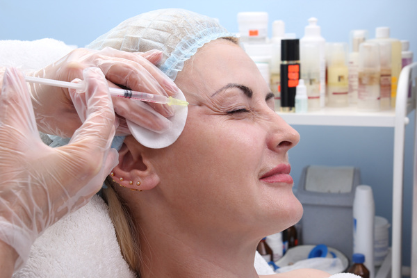 Middle-aged female facial botox injection Stock Photo 05