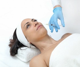 Middle-aged female facial botox injection Stock Photo 06