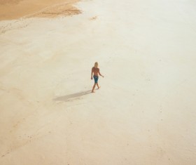 Person walking on empty seaside Stock Photo