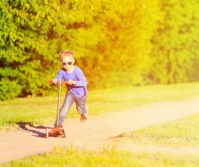 Play scooter little boy Stock Photo 03