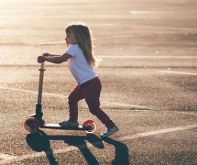 Play scooter little girl Stock Photo 01