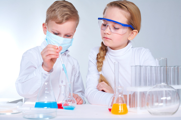 Pupil doing chemistry experiment Stock Photo