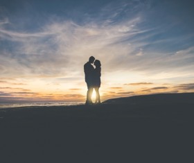 Romantic couple posing at sunset Stock Photo