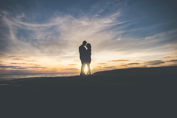 Romantic couple posing at sunset Stock Photo