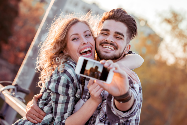 Romantic couple using smart phone selfie Stock Photo 02