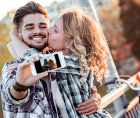 Romantic couple using smart phone selfie Stock Photo 03