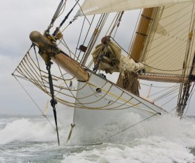 Sailboat ride the wind and waves Stock Photo