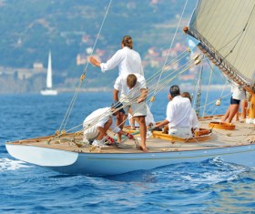 Sailing crew to put rigging in order Stock Photo