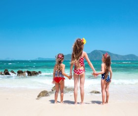 Sisters standing on the beach Stock Photo
