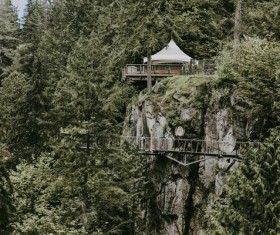 Small house and bridge on wild mountain landscape Stock Photo