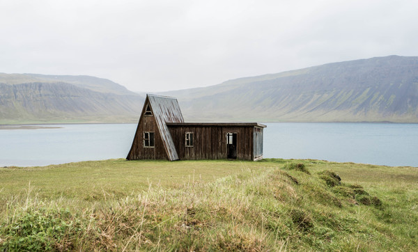 Small wooden house beside the lake Stock Photo
