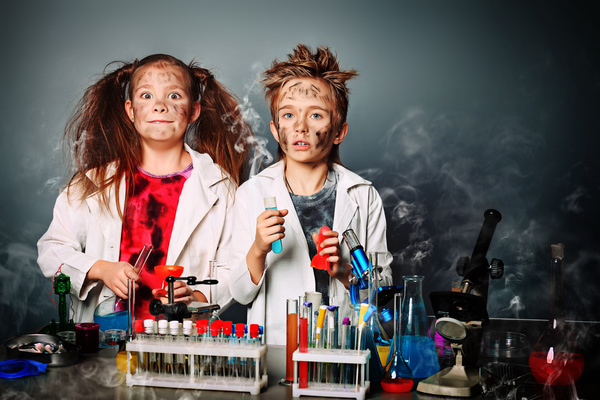 Students with funny facial expressions in chemistry class Stock Photo