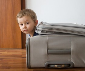 The child is hidden in the trunk Stock Photo