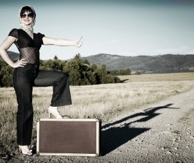Travel woman hitchhiking Stock Photo