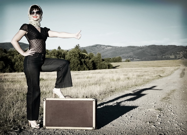 Travel woman hitchhiking Stock Photo