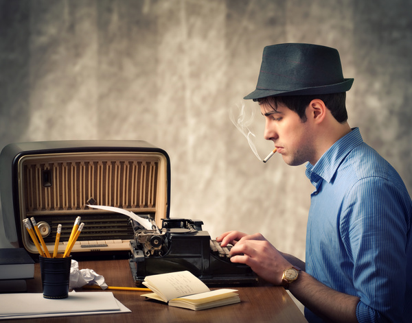Use old-fashioned typewriter typing man Stock Photo