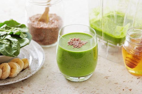 Vegetable juice and honey on the desktop Stock Photo