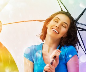 Woman feeling the fresh air in the rain Stock Photo 01