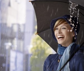Woman having fun with umbrella on rainy day Stock Photo 01
