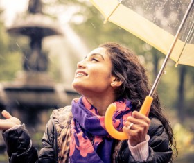 Woman having fun with umbrella on rainy day Stock Photo 03