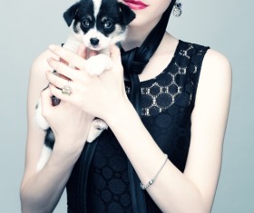 Woman holding pet dog Stock Photo 02