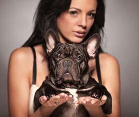 Woman holding pet dog Stock Photo 03