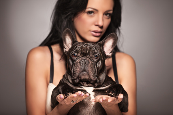 Woman holding pet dog Stock Photo 03