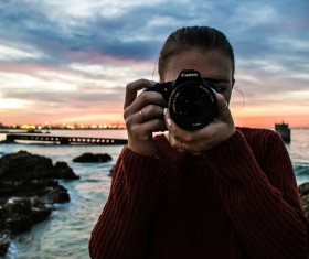 Woman joyful with camera hobby Stock Photo