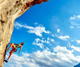 Woman rock climber climbs Stock Photo 01