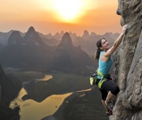 Woman rock climber climbs Stock Photo 04