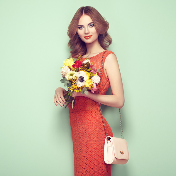 Woman wearing red dress holding flowers pose Stock Photo 01