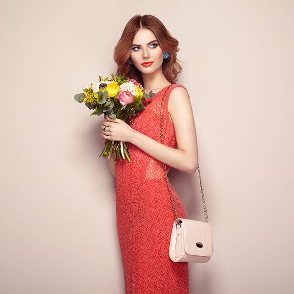 Woman wearing red dress holding flowers pose Stock Photo 03