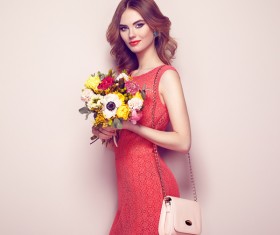 Woman wearing red dress holding flowers pose Stock Photo 05