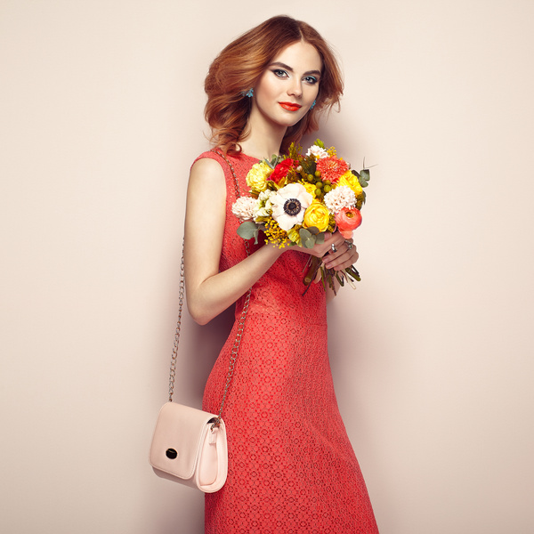 Woman wearing red dress holding flowers pose Stock Photo 06