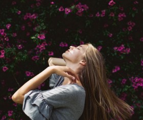 Woman with flower wall Stock Photo
