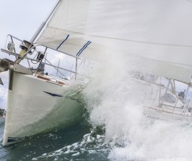 Yacht ride the wind and waves Stock Photo