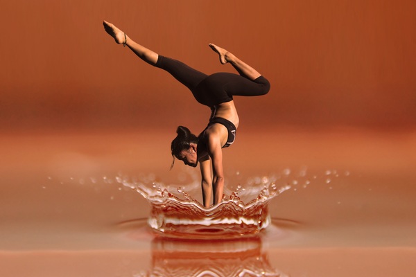 Yoga character with splash of water Stock Photo