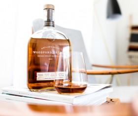 brandy bottle and cup on table Stock Photo