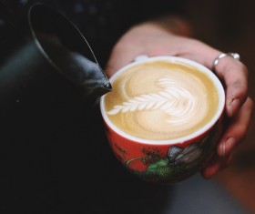 man holding beautiful milk coffee cup Stock Photo
