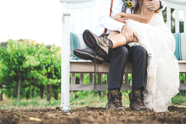 marriage couple hugging on bench Stock Photo