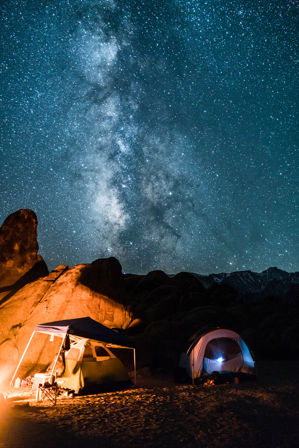 mountain camping under sparkling starry sky Stock Photo