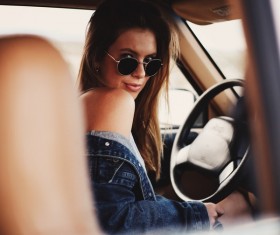 Attractive stylish woman posing in car Stock Photo