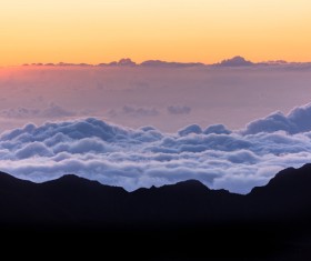 Beautiful cloudscape on high mountain range Stock Photo