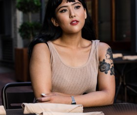 Beautiful stylish tattoo asian woman Stock Photo