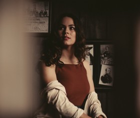 Beautiful young woman posing with classical style Stock Photo