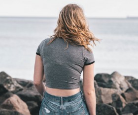 Blonde young girl relaxed on beach Stock Photo