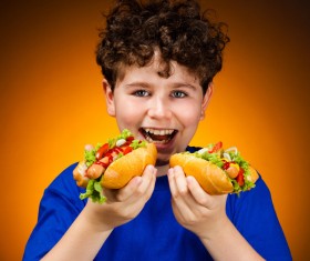 Boy eating hot dog Stock Photo 01