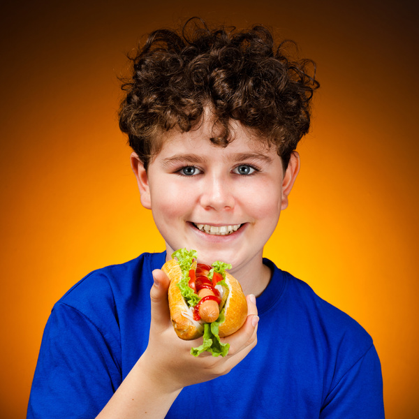 Boy eating hot dog Stock Photo 02