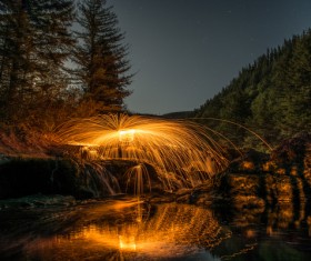 Bright water fountain in natural landscape Stock Photo
